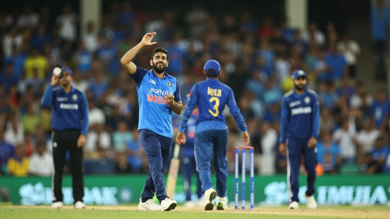 A medium tactical view of the Indian slip cordon and the bowler at the top of his mark during a domestic red-ball fixture, with field placement and ball condition visible
